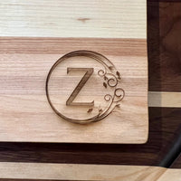 Detail image of the monogrammed board with an Z engraved into the bottom right